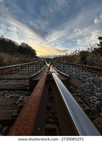 Railway Switch Tracks at Sunset With Dramatic Sky