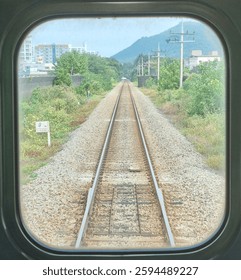 the railway through the window in a train