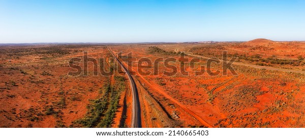 Railway\
track and Barrier Highway in outback near Broken Hill mining city\
of Far West NSW, Australia - aerial\
panorama.