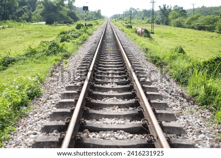 The railway track is a long, straight line.
