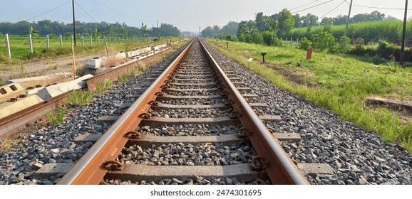 A railway track or railroad track, is the structure on a railway or railroad consisting of the rails. It enables trains to move by providing a dependable surface for their wheels to roll upon. - Powered by Shutterstock