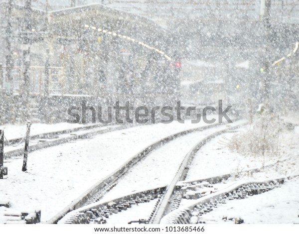 railway track and\
train station covered by snow while it is snowing on the heavy snow\
day in Tokyo area in\
Japan