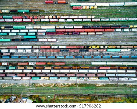 railway tracks and colorful wagons, top view, aerial shoot