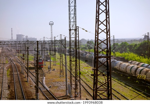 Railway tracks in the future. Train station near\
the city.