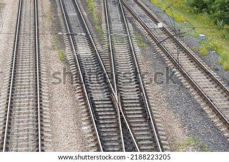 Railway tracks interchanges. A railway junction. Crossing parallel railroad tracks. Industrial background. Top view