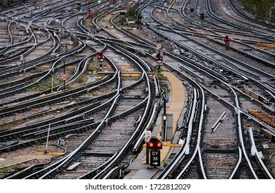 Railway tracks leading into a mainline overground station in London.