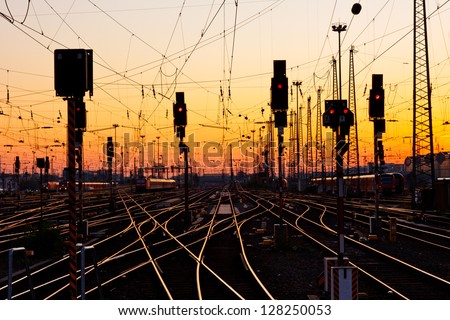 Railway Tracks at a Major Train Station at Sunset.