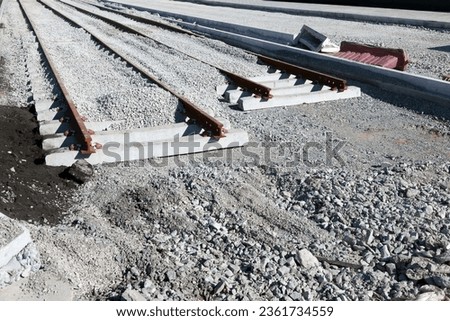 Railway tracks on the breakstone on the construction site
