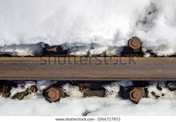 Railway train in the\
snow.