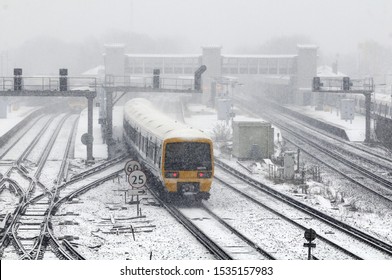 Railway Train In The Winter Snow In Kent, UK.