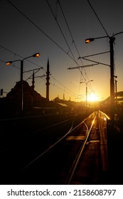 Railway Transport In Istanbul, Turkey. A Modern Tram Stop And Mosque During Sunset