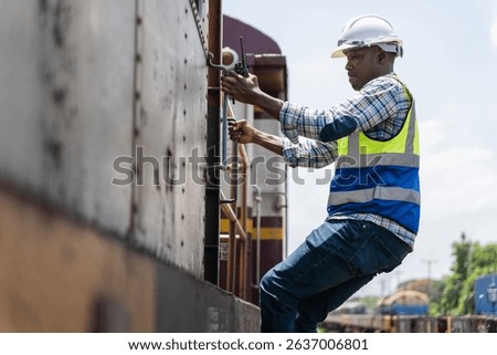 Railway transportation engineer checking freight train cars and cargo, Construction workers on a building site, with one worker climbing a ladder