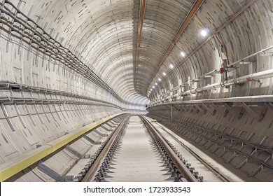 Railway underground tunnel which install running and conductor rail. Selective focus.