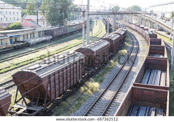 Railway wagons with cargo of metal and grain in the\
port. Railway wagons are followed by unloading, loading into an\
industrial port
