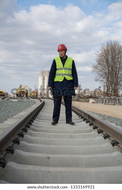 Railway worker with red\
helmet
