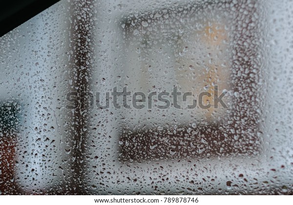 Rain background on car\
glass at window.