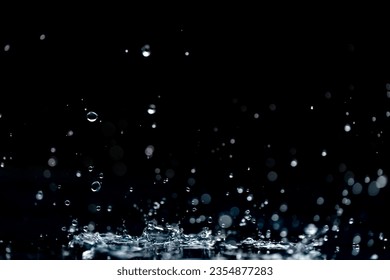 rain background. water droplets, splashes on a black background - Powered by Shutterstock