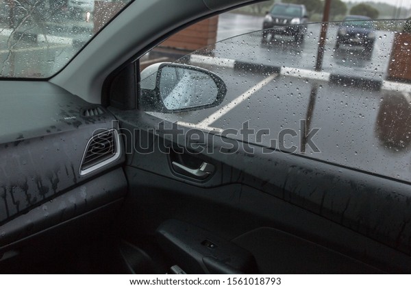 rain\
in the car, raindrops fly through the open\
window,