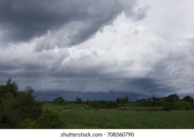 Rain Cloud Over Green Field Before Raining Hard.