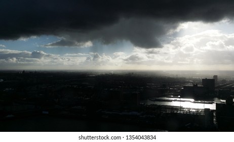 Rain Cloud With Sunshine In Rotterdam