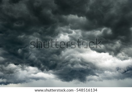 Rain clouds background.Clouds become dark gray like a big smoke before rainfall.Thunderstorm is a storm with lightning and thunder. Air pilots know that they must never fly through a thunder cloud. 
