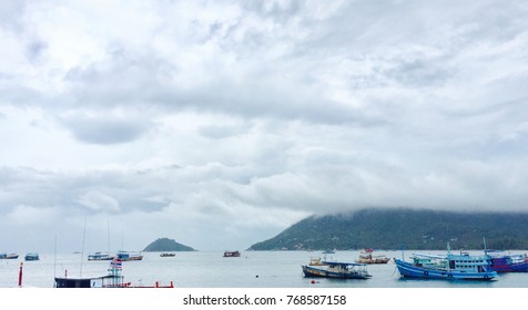 rain clouds with boat and the ocean