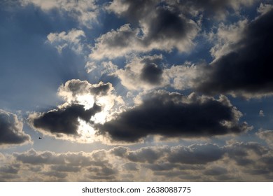 Rain clouds float across the sky over the sea