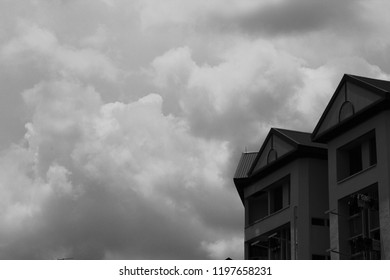 Rain clouds form over the building prior to rainfall