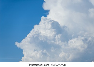 Rain clouds forming with blue sky background