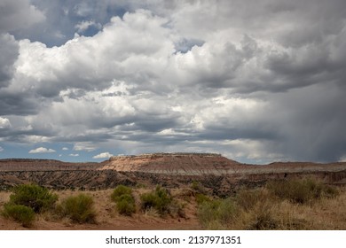 Rain Clouds Hang Over Desert Plateau In Capitol Reef National Park