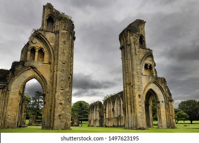 Rain clouds over Glastonbury Abbey monastery Great Church ruins from the 12th Century in Glastonbury, Somerset, England - June 13, 2019
