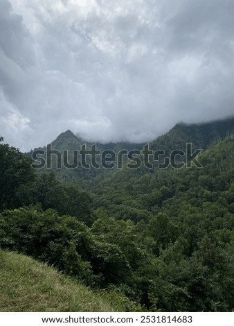 Similar – Image, Stock Photo Morning clouds rolling over the scenery and mountains over the Czech Republic creating different formations based on temperature, pressure and airflow. Meteorology