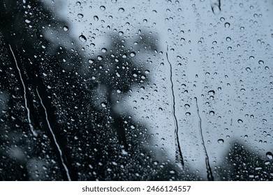 Rain and dew drop on the car glass window during raining. Dew is the moisture that forms as a result of condensation. - Powered by Shutterstock