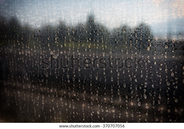 Rain dirty stains
over train window pain