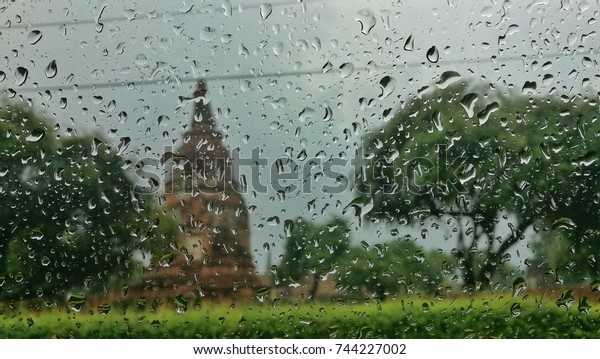 Rain drop off the window focus at water blur\
landscape background