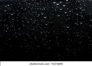 Rain Drop On Abstract Black Background