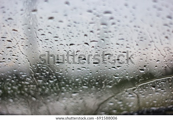 rain drop on the car\
glass in the road