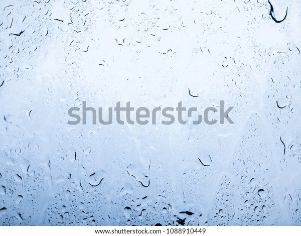 Rain drop on car window\
background,rain drop on windscreen,rainy season,rain water drop on\
car