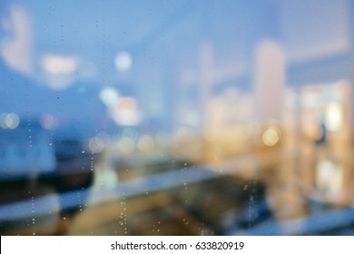 rain drop on clear glass window, reflection of blurred airport terminal and light bokeh from outside, beautiful color abstract for background - Shutterstock ID 633820919