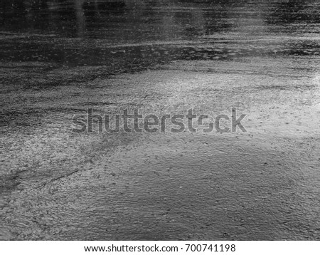 rain drop on wet asphalt road black and white style