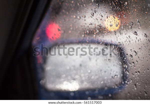 Rain drop at\
window of car causing bad\
vision