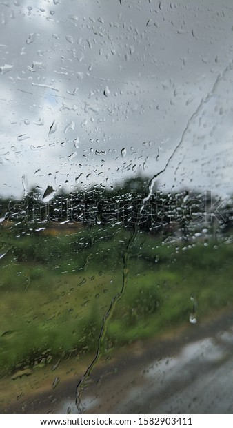 rain droplets on a bus\
Window glass 