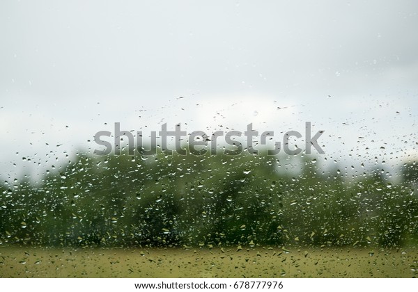 Rain droplets on the\
car window. Slovakia
