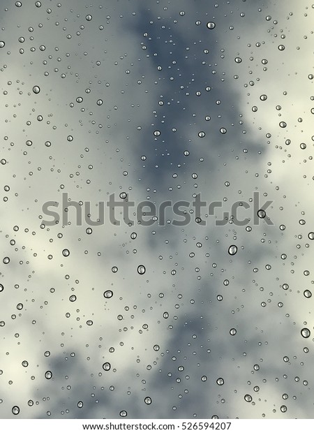 Rain
droplets on a window pain with sky in the
background