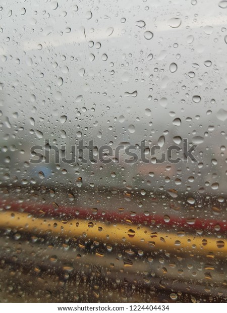 Rain droplets at the car’s
window