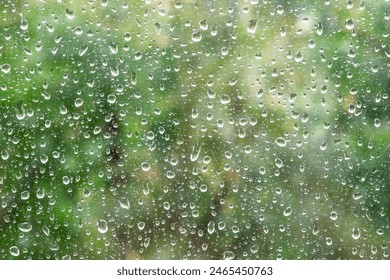 Rain drops close up on window glass outdoors. Summer rain. Texture of water in heavy rain. Macro.	 - Powered by Shutterstock