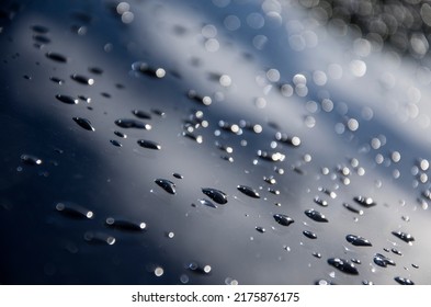 Rain Drops Close Up. Raindrops Roll Down The Glass. Rain Texture. Beautiful Background. Marine Background. Rain Glare Close-up. Drops Of Water On Glass. Close-up Of A Drop Of Water. Sparkling Raindrop