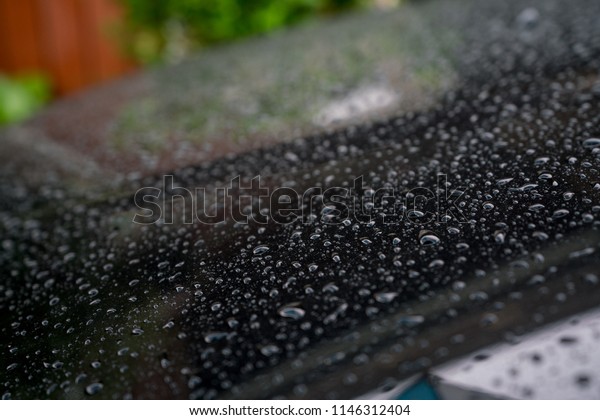 rain drops on\
a car after the rain, car\
accident