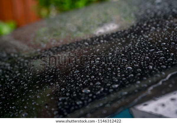 rain drops on\
a car after the rain, car\
accident