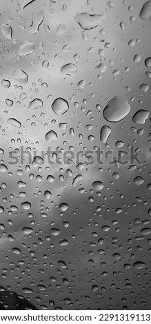 rain drops on car mirror .